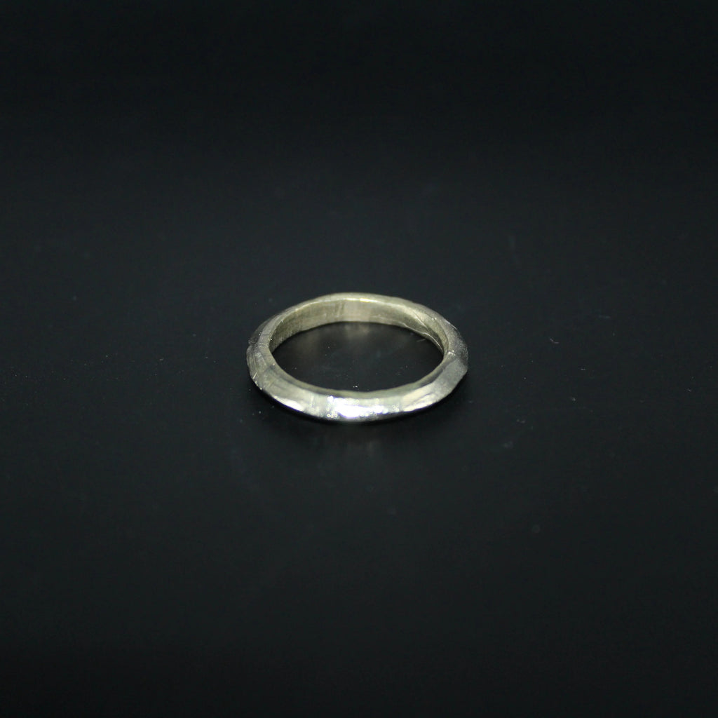 Silver ring on a black background