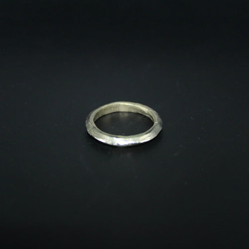 Silver ring on a black background
